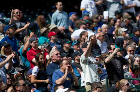 SEATTLE, WA – APRIL 19: Fans cheer as Evan Gattis #11 of the Houston Astros walks off the field after being tagged out by Daniel Vogelbach #20 of the Seattle Mariners to cause a triple play by starting to walk off the field with two outs in the fourth inning at Safeco Field on April 19, 2018, in Seattle, Washington. (Photo by Lindsey Wasson/Getty Images)