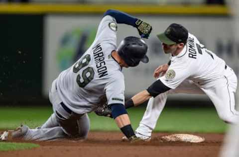 SEATTLE, WA – MAY 26: Shortstop Andrew Romine #7 of the Seattle Mariners tags out Logan Morrison #99 of the Minnesota Twins after Morrison tried to stretch a single into a double during the ninth inning of a game at Safeco Field on May 26, 2018, in Seattle, Washington. (Photo by Stephen Brashear/Getty Images)