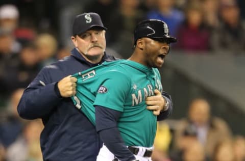 SEATTLE – MAY 06: Milton Bradley #15 of the Seattle Mariners is restrained by manager Eric Wedge #22 after being ejected from the game against the Chicago White Sox at Safeco Field on May 6, 2011 in Seattle, Washington. The Mariners won 3-2. (Photo by Otto Greule Jr/Getty Images)