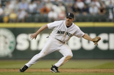 SEATTLE – JULY 15: Scott Spiezio #23 of the Seattle Mariners fields the ball during the game against the Cleveland Indians on July 15, 2004 at Safeco Field in Seattle, Washington. The Mariners defeated the Indians 2-1. (Photo by Otto Greule Jr/Getty Images)