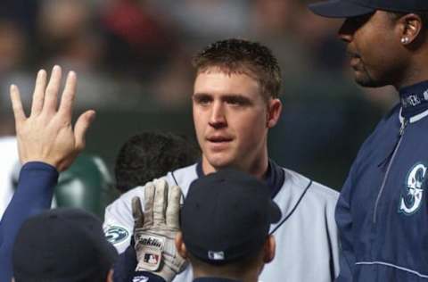 Dan Wilson of the Seattle Mariners (C) is congratulated by teammates. AFP PHOTO/Lee CELANO (Photo by LEE CELANO / AFP) (Photo credit should read LEE CELANO/AFP via Getty Images)