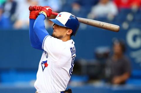 TORONTO, ON – AUGUST 16: Cavan Biggio #8 of the Toronto Blue Jays lines out in the first inning during a MLB game against the Seattle Mariners at Rogers Centre on August 16, 2019 in Toronto, Canada. (Photo by Vaughn Ridley/Getty Images)