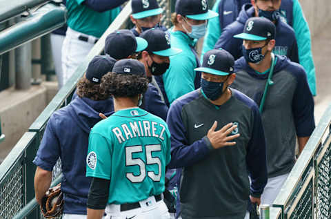 Yohan Ramirez and former Seattle Mariners pitcher Yoshihisa Hirano with the rest of the bullpen before a game against the Texas Rangers. (Photo by Stephen Brashear/Getty Images)