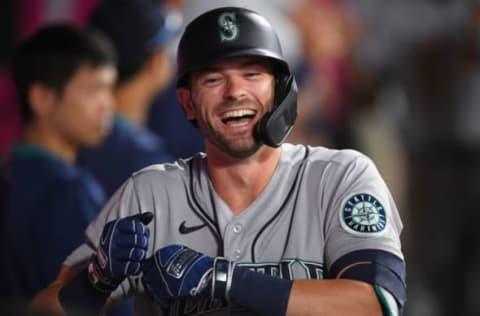 ANAHEIM, CA – JULY 16: Mitch Haniger #17 of the Seattle Mariners celebrates in the dugout after hitting a two run home run in the seventh inning of the game against the Los Angeles Angels at Angel Stadium of Anaheim on July 16, 2021 in Anaheim, California. (Photo by Jayne Kamin-Oncea/Getty Images)