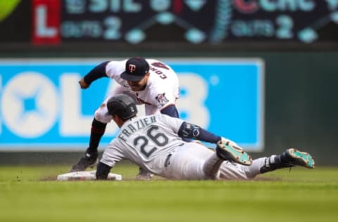 MINNEAPOLIS, MN – APRIL 09: Adam Frazier #26 of the Seattle Mariners is safe at second base after hitting an RBI double while Carlos Correa #4 of the Minnesota Twins applies the tag in the ninth inning of the game at Target Field on April 9, 2022 in Minneapolis, Minnesota. The Mariners defeated the Twins 4-3. (Photo by David Berding/Getty Images)