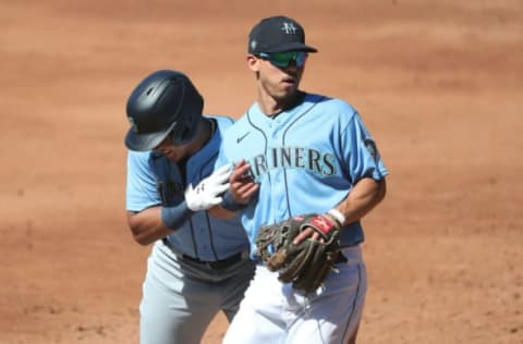 SEATTLE, WASHINGTON – JULY 14: Julio Rodriguez and Sam Haggerty of the Seattle Mariners interact during an intrasquad game. (Photo by Abbie Parr/Getty Images)