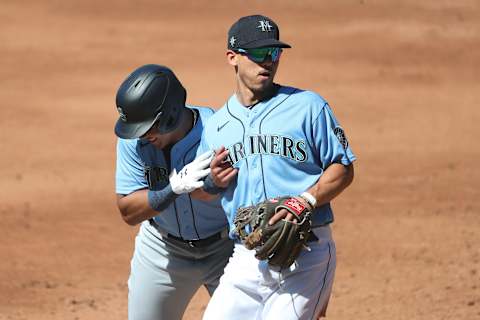 SEATTLE, WASHINGTON – JULY 14: Julio Rodriguez and Sam Haggerty of the Seattle Mariners interact. (Photo by Abbie Parr/Getty Images)