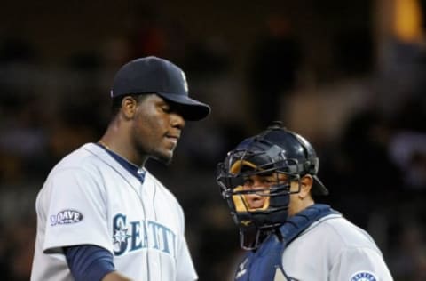 MINNEAPOLIS, MN – SEPTEMBER 21: Michael Pineda #36 and Miguel Olivo #30 of the Seattle Mariners speak during the game against the Minnesota Twins on September 21, 2011 at Target Field in Minneapolis, Minnesota. (Photo by Hannah Foslien/Getty Images)