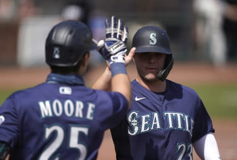 SAN FRANCISCO, CALIFORNIA – SEPTEMBER 17: Ty France #23 of the Seattle Mariners is congratulated by Dylan Moore #25 after France scored against the San Francisco Giants in the bottom of the second inning at Oracle Park on September 17, 2020 in San Francisco, California. (Photo by Thearon W. Henderson/Getty Images)