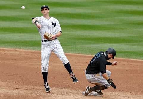 NEW YORK, NEW YORK – SEPTEMBER 26: (NEW YORK DAILIES OUT) DJ LeMahieu of the New York Yankees attempts to turn a double play on September 26, 2020. LeMahieu may be a potential target for Jerry Dipoto, Mariners general manager. (Photo by Jim McIsaac/Getty Images)