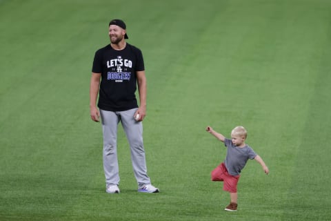 ARLINGTON, TEXAS – OCTOBER 08: Blake Treinen of the Dodgers celebrates with his son after defeating the Padres to advance to the NLCS. The Seattle Mariners may pursue him. (Photo by Tom Pennington/Getty Images)