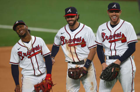 ARLINGTON, TEXAS – OCTOBER 16: The Atlanta Braves react during a pitching change. (Photo by Ronald Martinez/Getty Images)