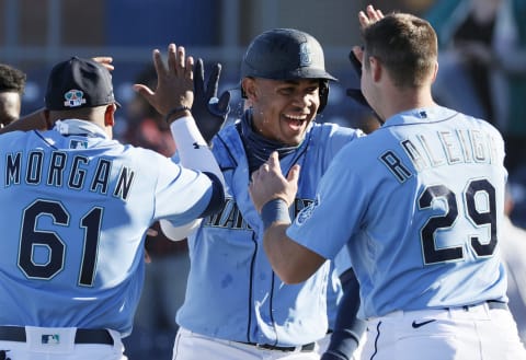 PEORIA, ARIZONA – FEBRUARY 28: Julio Rodríguez #85 of the Seattle Mariners reacts after hitting a walk-off single in the ninth inning to defeat the San Diego Padres 5-4 during the MLB spring training game at Peoria Sports Complex on February 28, 2021 in Peoria, Arizona. (Photo by Steph Chambers/Getty Images)