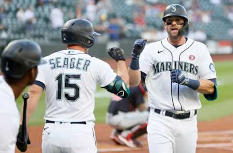 Kyle Seager and Mitch Haniger of the Seattle Mariners celebrate after a home run by Haniger against the Cleveland Indians during the first inning at T-Mobile Park on May 15, 2021, in Seattle, Washington. (Photo by Steph Chambers/Getty Images)