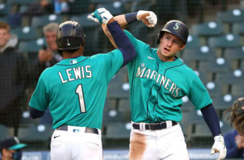 SEATTLE, WASHINGTON – MAY 28: Kyle Lewis #1 celebrates with Jarred Kelenic #10 of the Seattle Mariners after hitting a two-run home run during the third inning against the Texas Rangers at T-Mobile Park on May 28, 2021 in Seattle, Washington. (Photo by Abbie Parr/Getty Images)