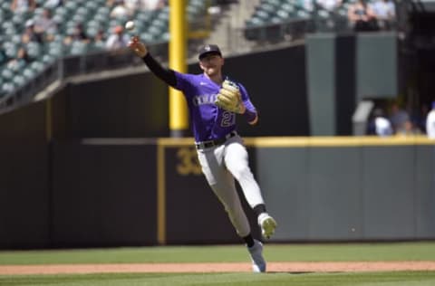 SEATTLE, WASHINGTON – JUNE 23: Trevor Story #27 of the Colorado Rockies makes a throw to first base during the game against the Seattle Mariners at T-Mobile Park on June 23, 2021 in Seattle, Washington. The Colorado Rockies beat the Seattle Mariners 5-2. (Photo by Alika Jenner/Getty Images)