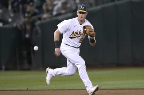 OAKLAND, CALIFORNIA – SEPTEMBER 07: Matt Chapman #26 of the Oakland Athletics reacts to field a ground ball off the bat of Andrew Vaughn #25 of the Chicago White Sox in the top of the seventh inning at RingCentral Coliseum on September 07, 2021 in Oakland, California. (Photo by Thearon W. Henderson/Getty Images)