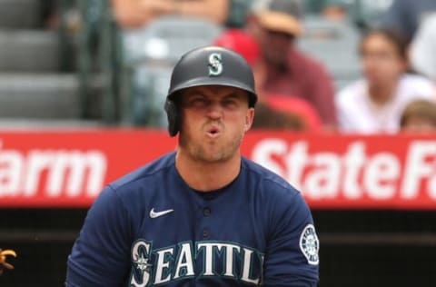 ANAHEIM, CALIFORNIA – SEPTEMBER 26: Kyle Seager #15 of the Seattle Mariners reacts after swinging at a pitch in the third inning against the Los Angeles Angels at Angel Stadium of Anaheim on September 26, 2021 in Anaheim, California. (Photo by Katharine Lotze/Getty Images)