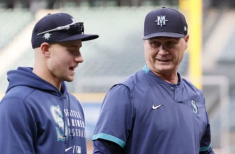 SEATTLE, WASHINGTON – OCTOBER 01: Jarred Kelenic #10 and manager Scott Servais #9 of the Seattle Mariners talk before the game against the Los Angeles Angels. (Photo by Steph Chambers/Getty Images)