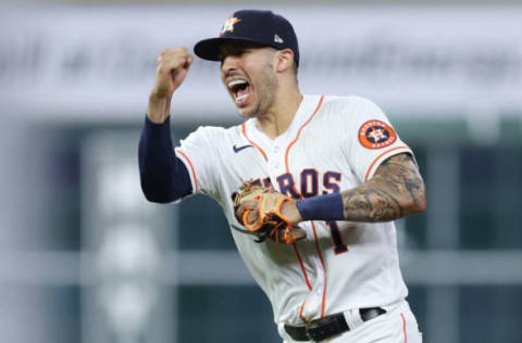 HOUSTON, TEXAS – OCTOBER 22: Carlos Correa #1 of the Houston Astros celebrates after tagging out Alex Verdugo #99 of the Boston Red Sox as he attempted to steal second base during the seventh inning in Game Six of the American League Championship Series at Minute Maid Park on October 22, 2021 in Houston, Texas. (Photo by Elsa/Getty Images)