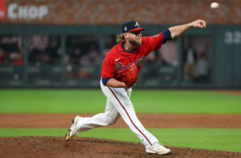 ATLANTA, GEORGIA – OCTOBER 29: A.J. Minter #33 of the Atlanta Braves delivers the pitch against the Houston Astros during the sixth inning in Game Three of the World Series at Truist Park on October 29, 2021 in Atlanta, Georgia. (Photo by Kevin C. Cox/Getty Images)