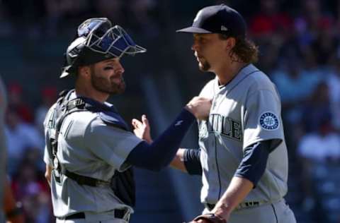 ANAHEIM, CALIFORNIA – SEPTEMBER 19: Catcher Curt Casali #5 and pitcher Logan Gilbert #36 of the Seattle Mariners celebrate at the end of the sixth inning against the Los Angeles Angels at Angel Stadium of Anaheim on September 19, 2022 in Anaheim, California. (Photo by Katelyn Mulcahy/Getty Images)