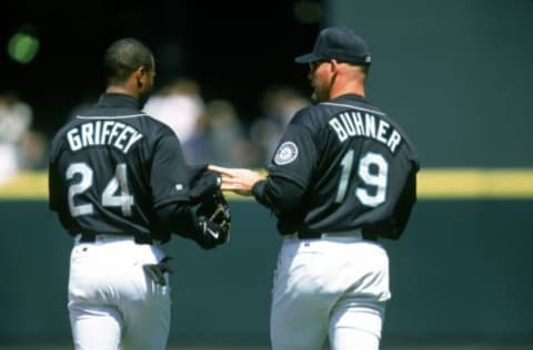 JULY 15, 1999: Jay Buhner (#19) and Ken Griffey Jr. (#24) of the Seattle Mariners talk during the Inaugural Game for Safeco Field on July 15, 1999 against the San Diego Padres. A capacity crowd of 47,000 attended the game. The Padres won 3-2. (Photo by Brad Mangin/MLB Photos via Getty Images)