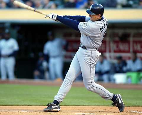 Seattle Mariners’ John Olerud follows through with a two-run homerun off Oakland Athletics’ pitcher Tim Hudson. AFP PHOTO/John G. MABANGLO (Photo by JOHN G. MABANGLO / AFP) (Photo credit should read JOHN G. MABANGLO/AFP via Getty Images)