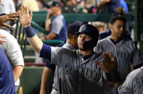 ARLINGTON, TX – SEPTEMBER 22: Mike Zunino #3 of the Seattle Mariners gets high fives in the dugout after scoring in the ninth inning against the Texas Rangers at Globe Life Park in Arlington on September 22, 2018, in Arlington, Texas. (Photo by Richard Rodriguez/Getty Images)