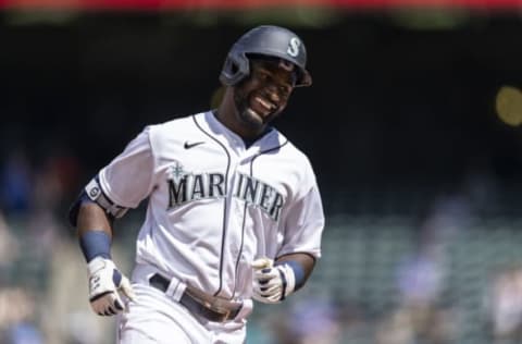 Jun 23, 2021; Seattle, Washington, USA; Seattle Mariners centerfielder Taylor Trammell (20) rounds the bases after hitting a solo home run off of Colorado Rockies starting pitcher German Marquez (48) during the sixth inning of a game at T-Mobile Park. Mandatory Credit: Stephen Brashear-USA TODAY Sports