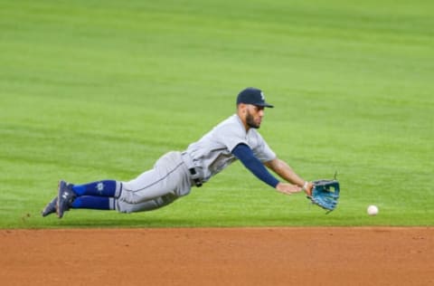 Jul 31, 2021; Arlington, Texas, USA; Seattle Mariners second baseman Abraham Toro (13) dives for a ground ball against the Texas Rangers during the fifth inning at Globe Life Field. Mandatory Credit: Andrew Dieb-USA TODAY Sports