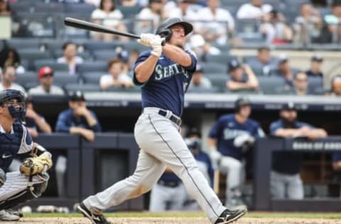 Aug 8, 2021; Bronx, New York, USA; Seattle Mariners third baseman Kyle Seager (15) hits an RBI double in the eighth inning against the New York Yankees at Yankee Stadium. Mandatory Credit: Wendell Cruz-USA TODAY Sports