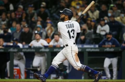 Aug 31, 2021; Seattle, Washington, USA; Seattle Mariners second baseman Abraham Toro (13) hits a grand slam home run against the Houston Astros during the eighth inning at T-Mobile Park. Mandatory Credit: Joe Nicholson-USA TODAY Sports