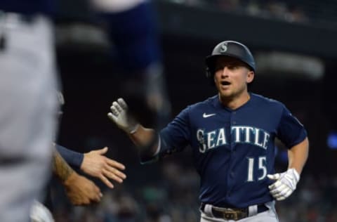 Sep 4, 2021; Phoenix, Arizona, USA; Seattle Mariners third baseman Kyle Seager (15) celebrates with teammates after hitting a three run home run against the Arizona Diamondbacks during the first inning at Chase Field. Mandatory Credit: Joe Camporeale-USA TODAY Sports