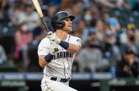 Sep 11, 2021; Seattle, Washington, USA; Seattle Mariners rightfielder Jake Bauers (5) takes a swing during an at-bat in a game against the Arizona Diamondbacks at T-Mobile Park. The Diamondbacks won 7-3. Mandatory Credit: Stephen Brashear-USA TODAY Sports