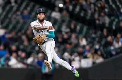 Sep 27, 2021; Seattle, Washington, USA; Seattle Mariners shortstop J.P. Crawford (3) throws to first base after fielding a ground ball against the Oakland Athletics during the sixth inning at T-Mobile Park. Mandatory Credit: Stephen Brashear-USA TODAY Sports