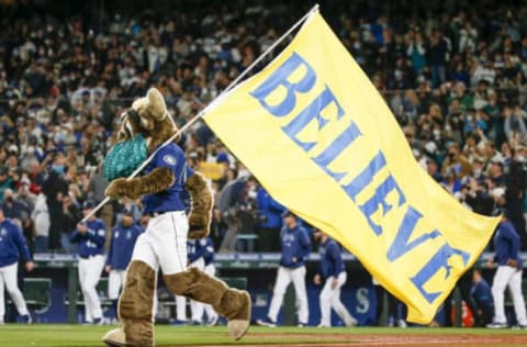 Oct 2, 2021; Seattle, Washington, USA; Seattle Mariners mascot Moose celebrates with a “Believe” flag following a victory over the Los Angeles Angels at T-Mobile Park. Mandatory Credit: Joe Nicholson-USA TODAY Sports