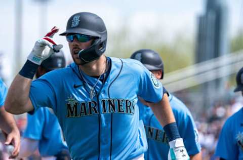 Mar 19, 2022; Peoria, Arizona, USA; Seattle Mariners outfielder Steven Souza Jr. (21) celebrates after hitting a grand slam in the first inning against the Los Angeles Dodgers during spring training at Peoria Sports Complex. Mandatory Credit: Allan Henry-USA TODAY Sports