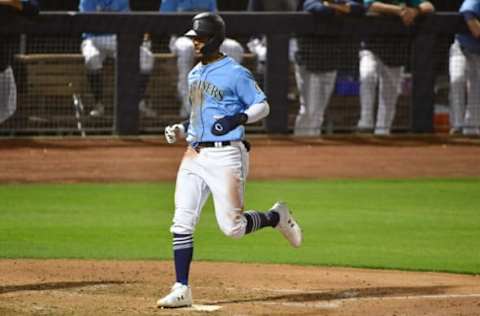 Mar 31, 2022; Peoria, Arizona, USA; Seattle Mariners center fielder Julio Rodriguez (44) scores in the third inning against the Cleveland Guardians during spring training at Peoria Sports Complex. Mandatory Credit: Matt Kartozian-USA TODAY Sports