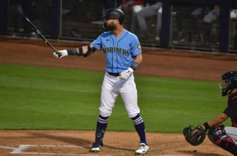 Mar 31, 2022; Peoria, Arizona, USA; Seattle Mariners right fielder Jesse Winker (27) at bat in the first inning against the Cleveland Guardians during spring training at Peoria Sports Complex. Mandatory Credit: Matt Kartozian-USA TODAY Sports