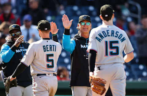 Apr 28, 2022; Washington, District of Columbia, USA; Miami Marlins manager Don Mattingly (8) celebrates with second baseman Jon Berti (5) and third baseman Brian Anderson (15) after the game against the Washington Nationals at Nationals Park. Mandatory Credit: Scott Taetsch-USA TODAY Sports