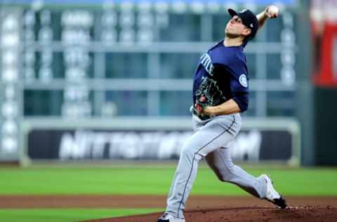 May 3, 2022; Houston, Texas, USA; Seattle Mariners starting pitcher Chris Flexen (77) delivers a pitch against the Houston Astros during the first inning at Minute Maid Park. Mandatory Credit: Erik Williams-USA TODAY Sports