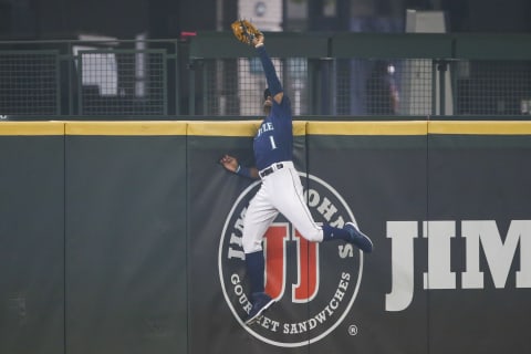 Sep 14, 2020; Seattle, Washington, USA; Seattle Mariners center fielder Kyle Lewis catches a would-be grand slam home run. Mandatory Credit: Joe Nicholson-USA TODAY Sports