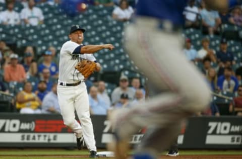 Aug 11, 2021; Seattle, Washington, USA; Seattle Mariners third baseman Kyle Seager (15) throws to first against the Texas Rangers during the second inning at T-Mobile Park. The runner was safe. Mandatory Credit: Joe Nicholson-USA TODAY Sports