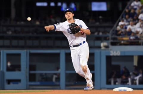 Aug 18, 2021; Los Angeles, California, USA; Los Angeles Dodgers shortstop Corey Seager (5) throws to first base on a ground out by Pittsburgh Pirates right fielder Gregory Polanco (not pictured) during the eighth inning at Dodger Stadium. Mandatory Credit: Richard Mackson-USA TODAY Sports