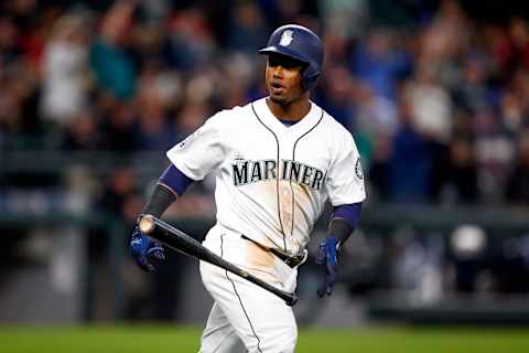 May 3, 2017; Seattle, WA, USA; Seattle Mariners shortstop Jean Segura (2) tosses his bat to the dugout after hitting a two-run homer against the Los Angeles Angels during the fifth inning at Safeco Field. Mandatory Credit: Joe Nicholson-USA TODAY Sports