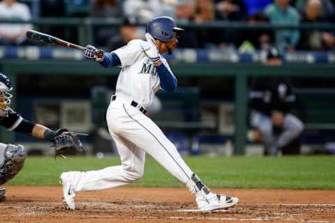 May 18, 2017; Seattle, WA, USA; Seattle Mariners center fielder Jarrod Dyson (1) hits a single against the Chicago White Sox during the fifth inning at Safeco Field. Mandatory Credit: Joe Nicholson-USA TODAY Sports