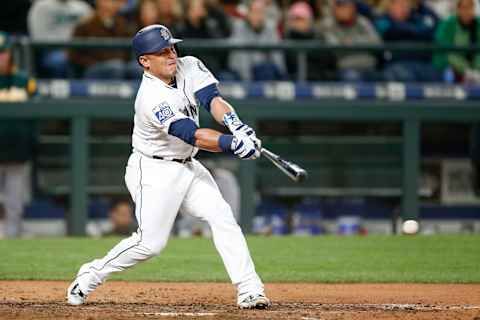 May 16, 2017; Seattle, WA, USA; Seattle Mariners catcher Carlos Ruiz (52) hits an RBI-fielders choice against the Oakland Athletics during the seventh inning at Safeco Field. Mandatory Credit: Joe Nicholson-USA TODAY Sports