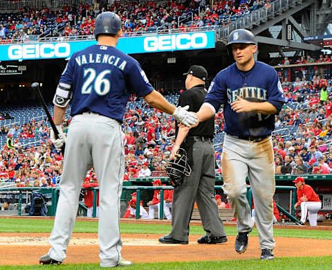 May 24, 2017; Washington, DC, USA; Seattle Mariners third baseman Kyle Seager (15) celebrates with first baseman Danny Valencia (26) after scoring a run against the Washington Nationals during the first inning at Nationals Park. Mandatory Credit: Brad Mills-USA TODAY Sports