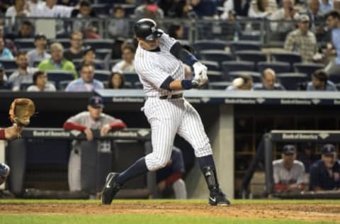 Sep 28, 2015; Bronx, NY, USA; New York Yankees designated hitter Alex Rodriguez (13) hits a single during the fifth inning of the game against the Boston Red Sox at Yankee Stadium. Mandatory Credit: Gregory J. Fisher-USA TODAY Sports